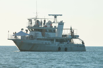 Scientists scan the ocean from the 'flying deck' of research vessel Narval